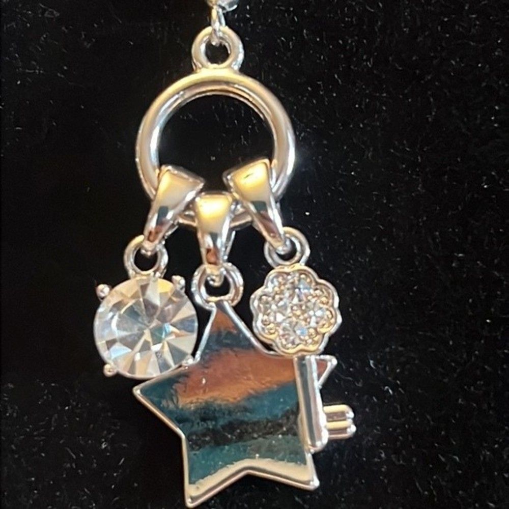 Fun silver tone dangle earrings. - Picture 2 of 3